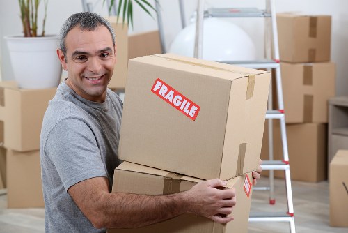 Team member loading items safely into a van