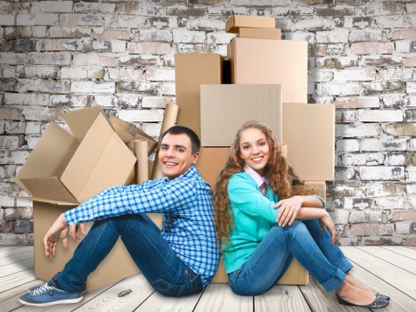Professional moving team handling furniture in a Southfields flat with limited access
