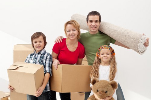 Packed moving boxes and furniture prepared for a Southfields home relocation