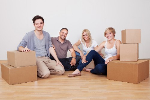 Packed office boxes and desks prepared for a Southfields business move